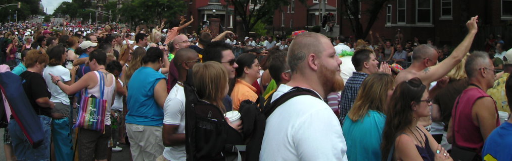 Crowd on the parade route Click to enlarge child carrier