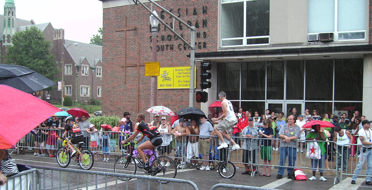 Unicycles in the rain Good shot of rainy scene with unicyclist