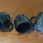 three spilled cups